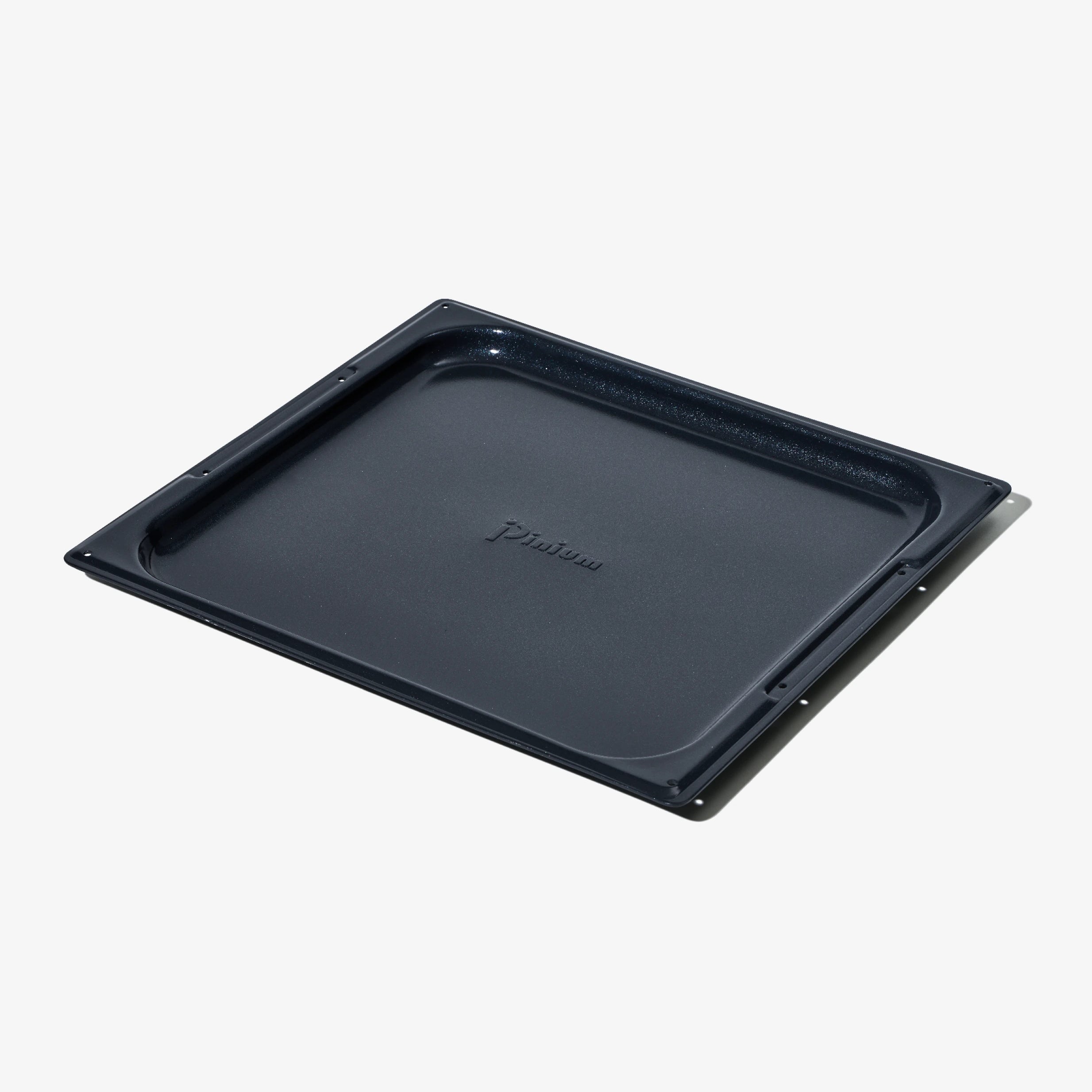 Pizzaplåt i non-stick, rektangulär ugnsform med upphöjda kanter.