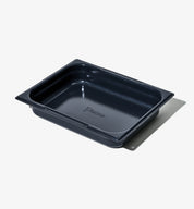 Ugnsform i mörkblått med non-stick-yta, sedd uppifrån, tom.