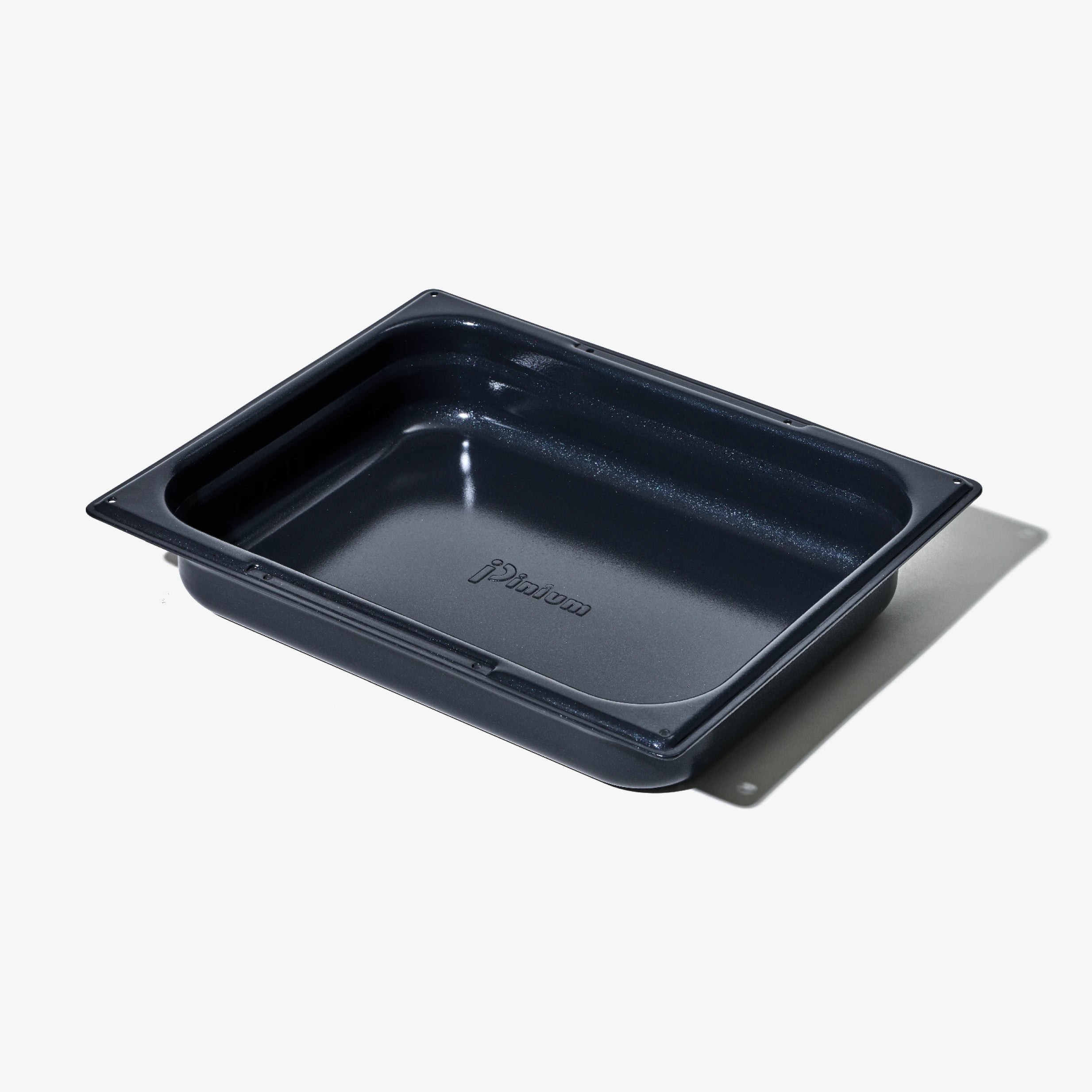 Ugnsform i mörkblått med non-stick-yta, sedd uppifrån, tom.